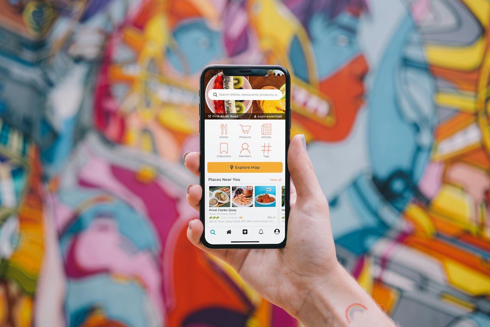 A phone running an app, held in one hand